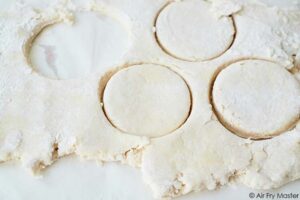Cut out biscuit dough.