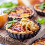 Caramelized Onion Quiche in tart pans.